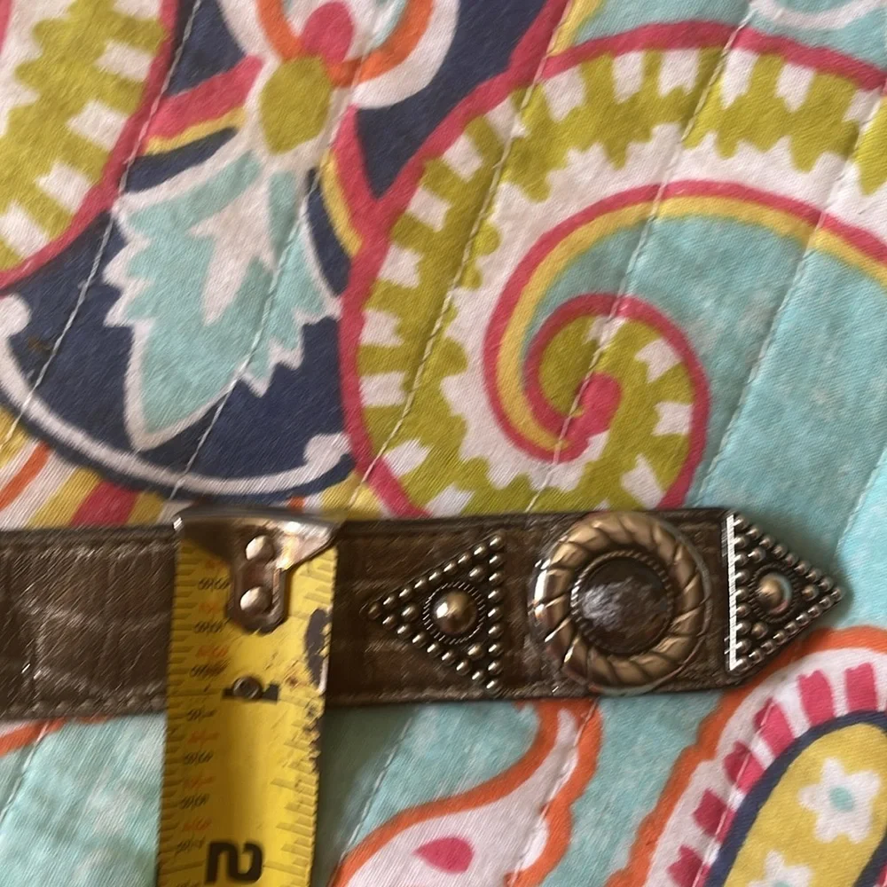Leatherock bronze, and silver alligator or snake statement, leather belt